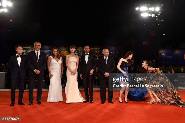 Festival director Alberto Barbera , Angeles Woo, Ha Ji-Won, Zhang Hanyu, John Woo, Qi Wei, Tao Okamoto and guest walk the red carpet ahead of the...