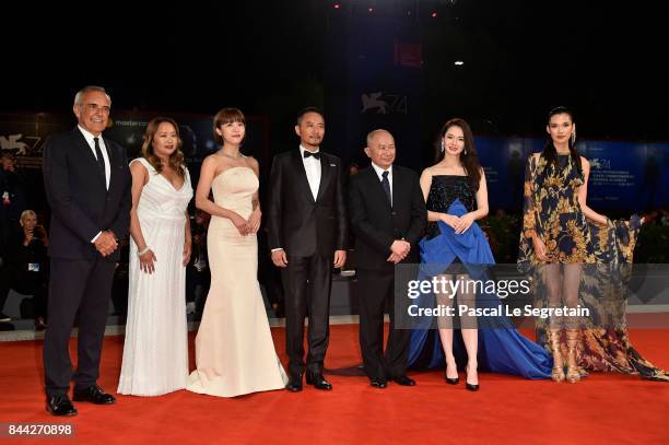 Festival director Alberto Barbera, Angeles Woo, Ha Ji-Won, Zhang Hanyu, John Woo, Qi Wei and Tao Okamoto walk the red carpet ahead of the 'Manhunt '...