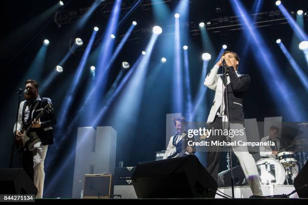 Pelle Almqvist, Vigilante Carlstroem, and Johan Gustafsson of the Swedish garage rock band The Hives perform in concert at Grona Lund on September 8,...