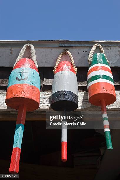 three buoys - fishing float stock pictures, royalty-free photos & images