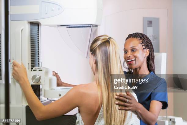 woman getting mammogram - mammogram diversity stock pictures, royalty-free photos & images