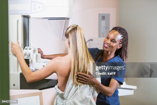 woman getting mammogram - mammogram diversity stock pictures, royalty-free photos & images