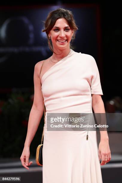 Mathilde Auneveux walks the red carpet ahead of the 'Jusqu'a La Garde' screening during the 74th Venice Film Festival at Sala Grande on September 8,...