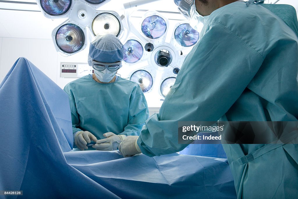 Surgeons performing operation