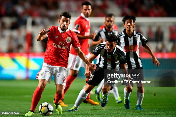 Benfica's midfielder Pizzi Fernandes vies with Portimonense's midfielder Pedro Sa during the Portuguese league football match SL Benfica vs...