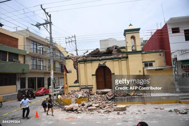 Picture taken on September 8, 2017 in Juchitan de Zaragoza, state of Oaxaca, where buildings collapsed after an 8.2 earthquake that hit Mexico's...