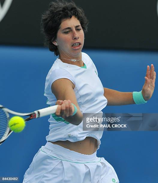 Carla Suarez Navarro of Spain plays a return stroke during her women's singles match against compatriot Maria Jose Martinez Sanchez at the Australian...