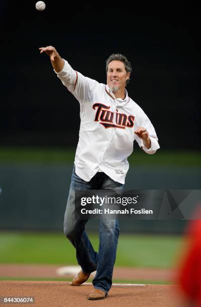 Former closer Joe Nathan for the Minnesota Twins delivers a ceremonial pitch before the game between the Minnesota Twins and the Kansas City Royals...