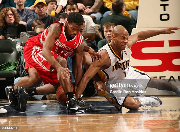 Aaron Brooks of the Houston Rockets battles Jarrett Jack of the Indiana Pacers at Conseco Fieldhouse on January 23, 2009 in Indianapolis, Indiana....