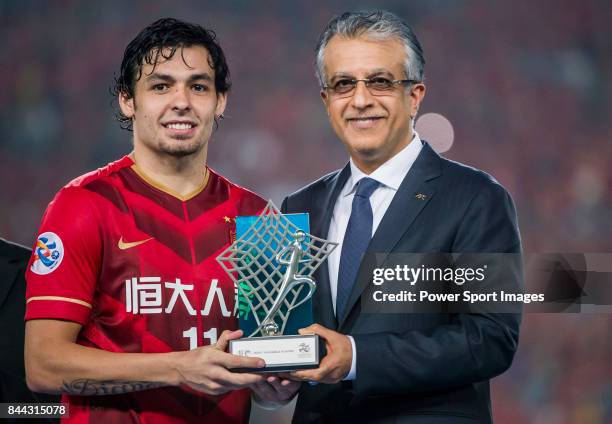 President Shaikh Salman bin Ebrahim Al Khalifa presents the MVP Award to Guangzhou Evergrande midfielder Ricardo Goulart after the AFC Champions...