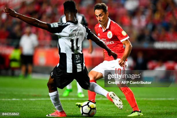 Benfica's Brazilian forward Jonas Oliveira vies with Portimonense's Ghanaian defender Emmanuel Hackman during the Portuguese league football match SL...