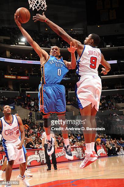 Russell Westbrook of the Oklahoma City Thunder has his shot challenged by DeAndre Jordan of the Los Angeles Clippers at Staples Center on January 23,...