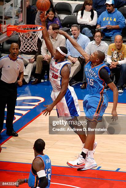 Al Thornton of the Los Angeles Clippers puts up a shot against Kevin Durant of the Oklahoma City Thunder at Staples Center on January 23, 2009 in Los...