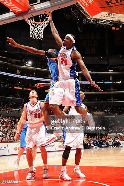 Cheikh Samb of the Los Angeles Clippers rises for a shot against the Oklahoma City Thunder at Staples Center on January 23, 2009 in Los Angeles,...