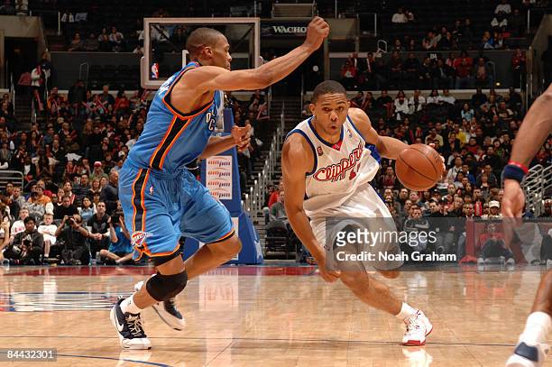 Eric Gordon of the Los Angeles Clippers drives against Russell Westbrook of the Oklahoma City Thunder at Staples Center on January 23, 2009 in Los...