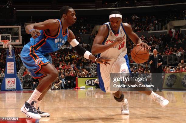 Al Thornton of the Los Angeles Clippers drives against Jeff Green of the Oklahoma City Thunder at Staples Center on January 23, 2009 in Los Angeles,...