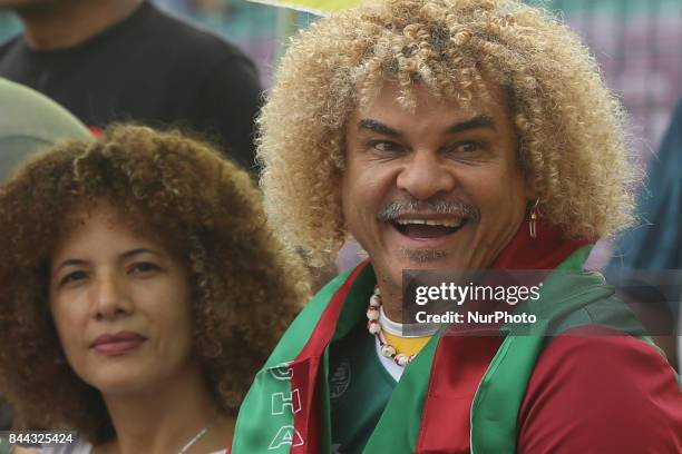Colombian Former footballer Carlos Valderrama, who played in three World Cup tournaments, poses for pictures with his wife Elvira during an event...