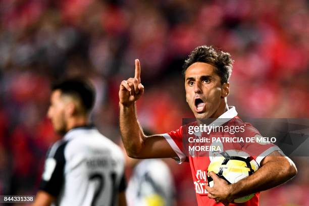 Benfica's Brazilian forward Jonas Oliveira celebrates after scoring on a penalty kick during the Portuguese league football match SL Benfica vs...