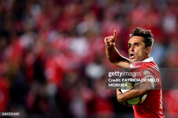 Benfica's Brazilian forward Jonas Oliveira celebrates after scoring on a penalty kick during the Portuguese league football match SL Benfica vs...