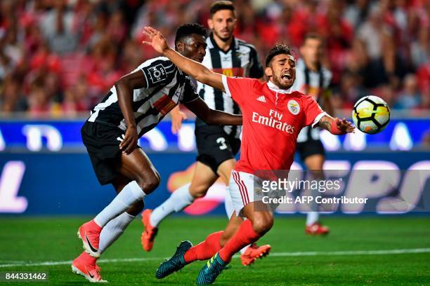 Benfica's Argentine midfielder Eduardo Salvio vies with Portimonense's Ghanaian defender Emmanuel Hackman during the Portuguese league football match...