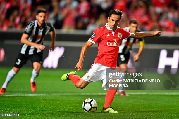 Benfica's Brazilian forward Jonas Oliveira makes a penalty kick during the Portuguese league football match SL Benfica vs Portimonense SAD at the Luz...