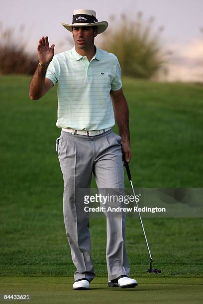 Alvaro Quiros of Spain acknowledges the crowd after a birdie on the 17th hole during the third round of the Commercialbank Qatar Masters at Doha Golf...