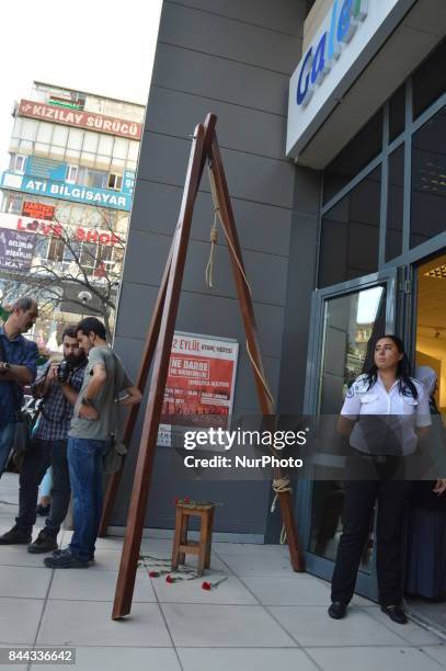 Security stands next to a gallows on the opening day of the September 12 Shame Museum, which is held with the help of the main opposition Republican...