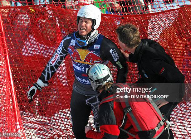 Lanning is helped by medics after crashing down the famous Hahnenkamm downhill during the mens World cup downhill in Kitzbuhel on January 24, 2009....