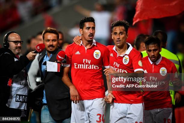 Benfica's defender Andre Almeida celebrates with his teammate Benfica's Brazilian forward Jonas Oliveira after scoring during the Portuguese league...