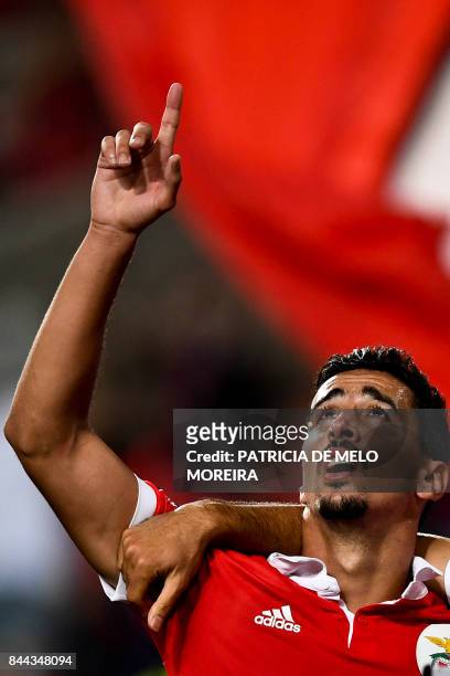 Benfica's defender Andre Almeida celebrates after scoring during the Portuguese league football match SL Benfica vs Portimonense SAD at the Luz...