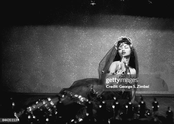 Cuban-born Isabella Garcia , better known as Chelo Alonso, poses as Cleopatra while performing at an unidentified New Orleans venue, 1955. United...