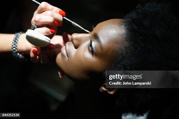 Model prepares backstage during the Katie Gallagher presentation September 2017 during New York Fashion Week on September 8, 2017 in New York City.