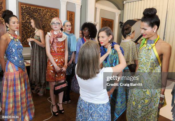 Designer Marisol Deluna prepares models backstage at Marisol Deluna NYFW Runway Show during New York Fashion Week at The National Arts Club on...