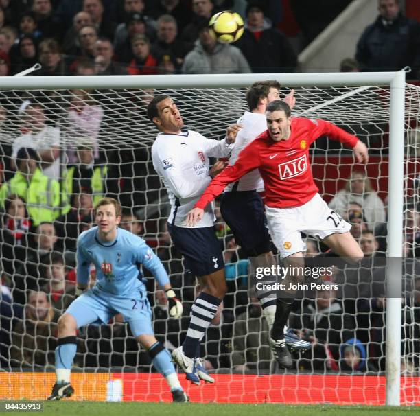 John O'Shea of Manchester United clashes with Tom Huddlestone of Tottenham Hotspur during the FA Cup sponsored by E.on Fourth Round match between...