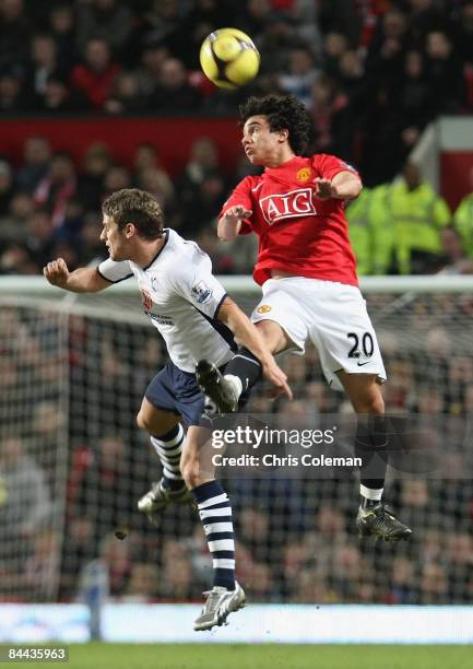 Fabio Da Silva of Manchester United clashes with David Bentley of Tottenham Hotspur during the FA Cup sponsored by e.on Fourth Round match between...
