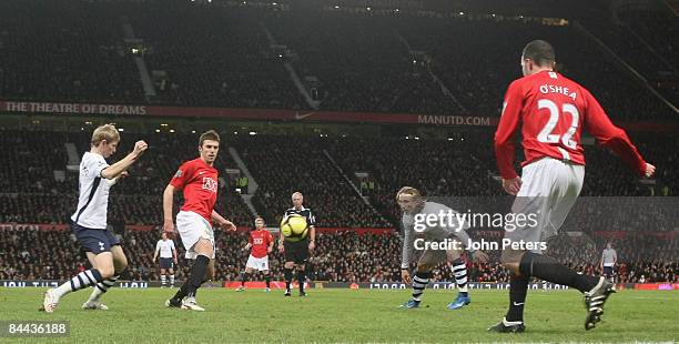 Michael Carrick and John O'Shea of Manchester United clash with Roman Pavlyuchenko and Luka Modric of Tottenham Hotspur during the FA Cup sponsored...