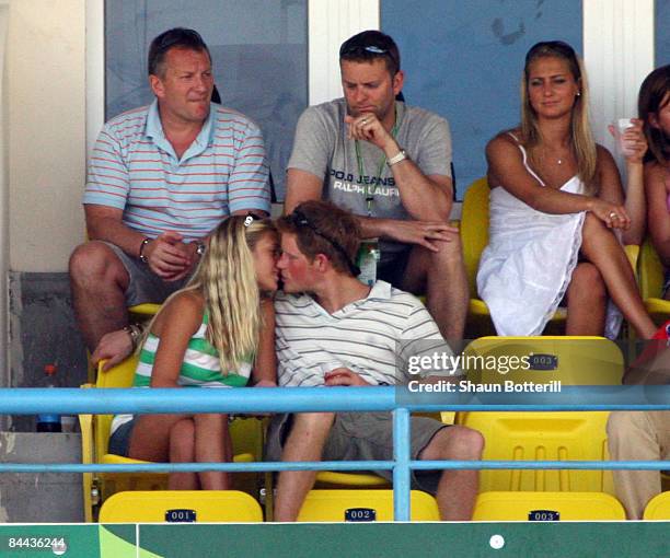 Prince Harry kisses girlfriend Chelsy Davy as they watch the action during the ICC Cricket World Cup 2007 Super Eight match between England and...