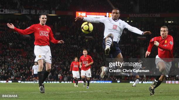 John O'Shea and Nemanja Vidic of Manchester United clashes with Jermain Defoe of Tottenham Hotspur during the FA Cup sponsored by e.on Fourth Round...