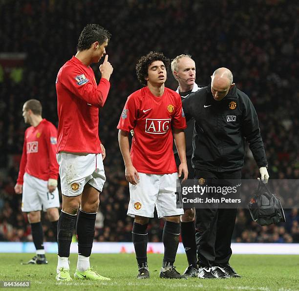 Fabio Da Silva of Manchester United leaves the pitch with an injury during the FA Cup sponsored by e.on Fourth Round match between Manchester United...