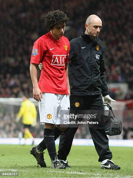 Fabio Da Silva of Manchester United leaves the pitch with an injury during the FA Cup sponsored by e.on Fourth Round match between Manchester United...