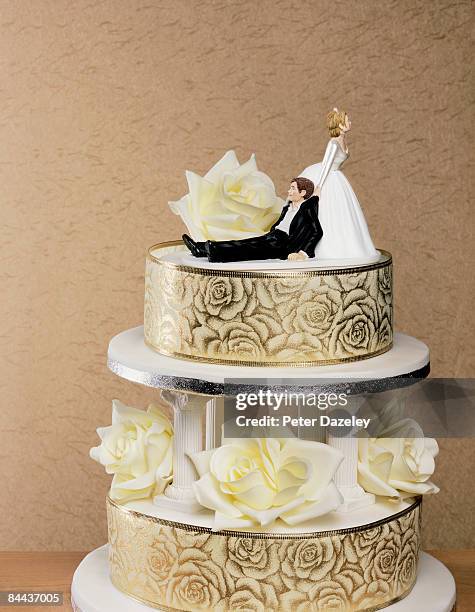 wedding cake with wife dragging husband - drunk husband stock pictures, royalty-free photos & images