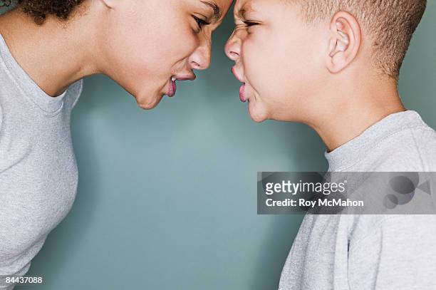 kids portraits - kids arguing stock pictures, royalty-free photos & images