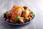 Roast chicken with potato and mushrooms