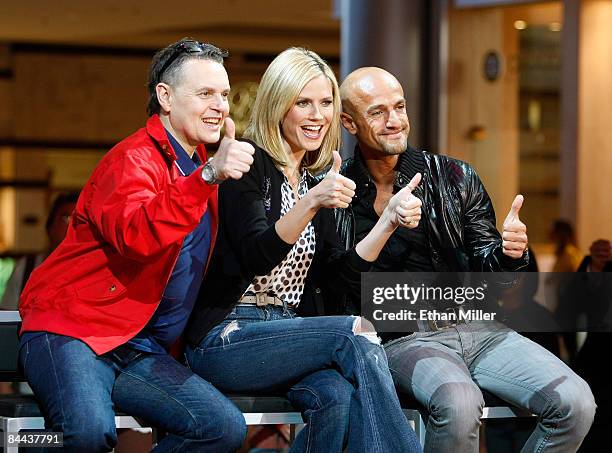 Co-hosts and judges of "Germany's Next Topmodel" Rolf Scheider, model Heidi Klum and Peyman Amin joke around during a taping of the television show...