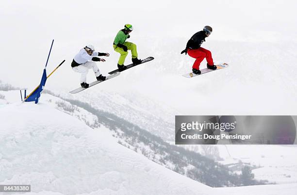 Competitors go airborne as they race head to head in the Men's Snowboarder X at Winter X Games 13 on Buttermilk Mountain on January 24, 2009 in...