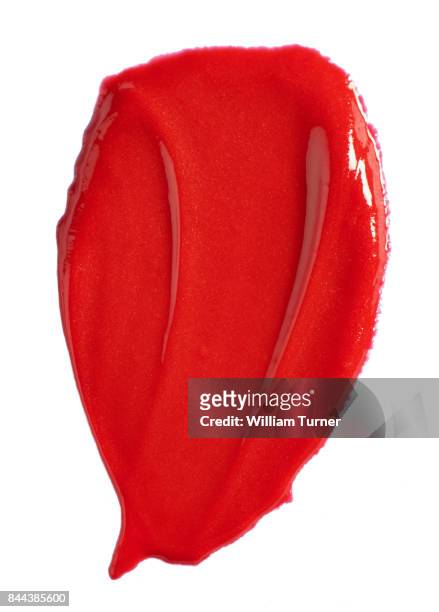 a beauty cut out image of red lip gloss - william turner london stockfoto's en -beelden