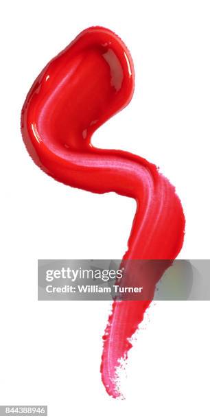 a beauty cut out image of red lip gloss - william turner london stockfoto's en -beelden