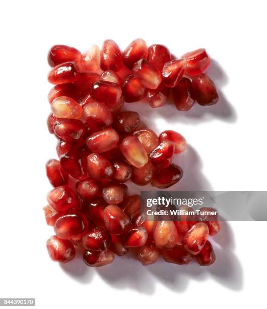 a cut out food image of pomegranate fruit seeds - william turner london stock pictures, royalty-free photos & images