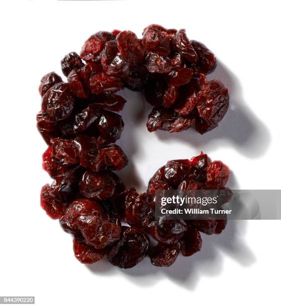 a cut out food image of dried cranberries - william turner london stock-fotos und bilder