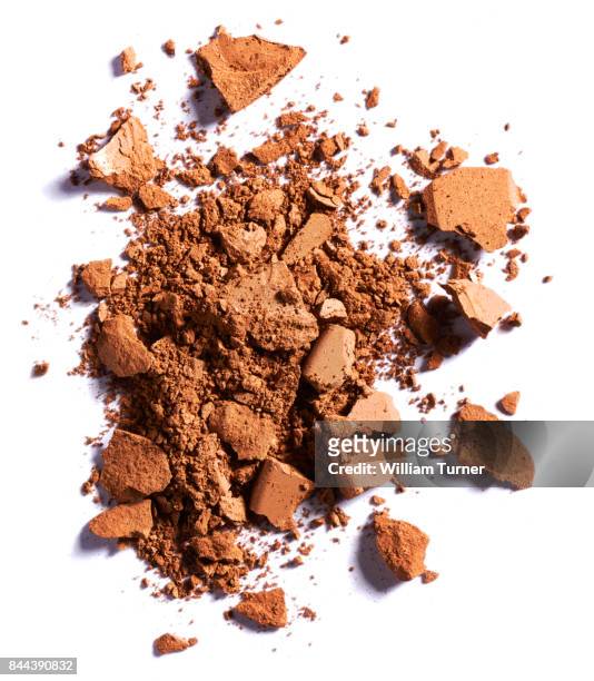 a beauty cut out image of a crushed or broken sample of bronzer make up powder - william turner london stockfoto's en -beelden